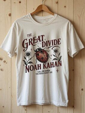 Noah Kahan with red ladybug shirt white